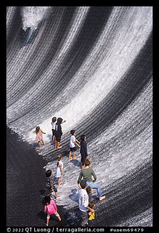 Visitors interacting with water feature. Expo 2020, Dubai, United Arab Emirates (color)