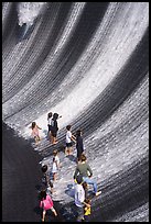 Visitors interacting with water feature. Expo 2020, Dubai, United Arab Emirates ( color)