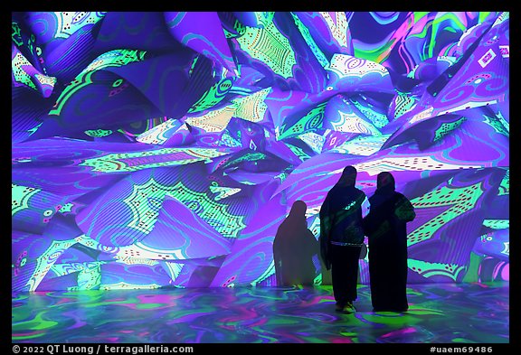 Women interacting with light show, Pakistan Pavilion. Expo 2020, Dubai, United Arab Emirates (color)