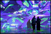 Women interacting with light show, Pakistan Pavilion. Expo 2020, Dubai, United Arab Emirates ( color)