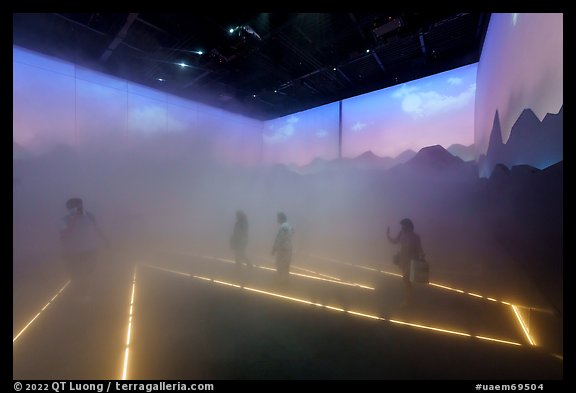 Visitors walk in Swizerland Pavilion fog. Expo 2020, Dubai, United Arab Emirates (color)