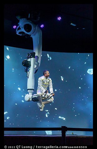 Man performing with robotic arm, Kazakhstan Pavilion. Expo 2020, Dubai, United Arab Emirates (color)