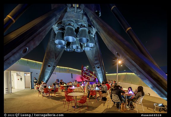 Rocket Garden below the landing legs of Falcon 9 rocket at night, USA Pavilion. Expo 2020, Dubai, United Arab Emirates
