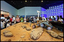 Visitors looking at Mars rover exhibit, USA Pavilion. Expo 2020, Dubai, United Arab Emirates ( color)