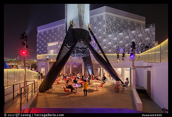 Booster rocket on landing legs and pavilion, USA Pavilion. Expo 2020, Dubai, United Arab Emirates (color)