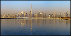 Downtown Dubai skyline with reflections in Dubai Creek. United Arab Emirates (Panoramic color)