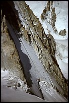Two parties climbing on the lower half of the North face of Tour Ronde, Mont-Blanc range, Alps, France. (color)
