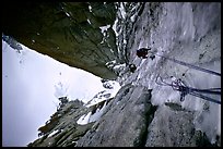 Climbers Frank and Alain climb thin ice in the Super-Couloir on Mt Blanc du Tacul, Mont-Blanc Range, Alps, France. (color)