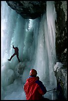Paul and Vincent are going to avoid the vertical free standing section of the main falls of Gialorgues by climbing through an ice-tunnel, an experience of rare beauty. Alps, France ( color)