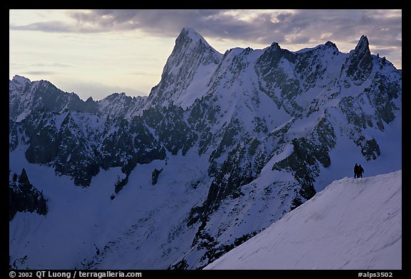 Alpinists go down Aiguille du Midi on a sharp ridge. Alps, France (color)