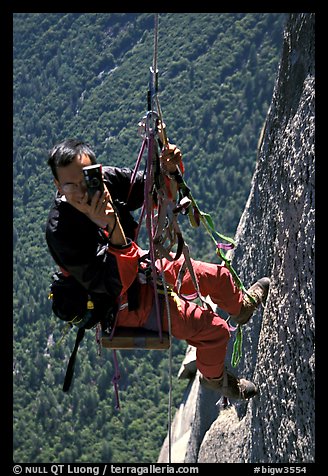 Climbing photographer at work. Yosemite, California (color)
