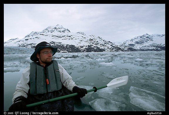 Kayaker on ice-chocked waters close to John Hopkins Inlet. Glacier Bay National Park, Alaska