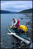 Kayaker packing tight into a double kayak. Glacier Bay National Park, Alaska ( color)