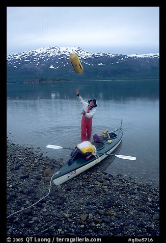 bay glacier alaska kayak kayaker unloading sacks throwing stuff national park mountain terragalleria