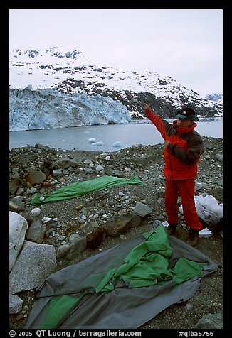 Setting up a tent in front of Lamplugh Glacier. Glacier Bay National Park, Alaska (color)