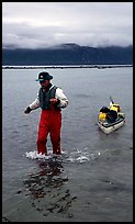 Kayaker towing kayak, East arm. Glacier Bay National Park, Alaska ( color)