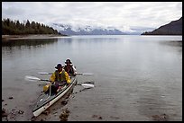 Kayakers land in Hugh Miller Inlet. Glacier Bay National Park, Alaska ( color)