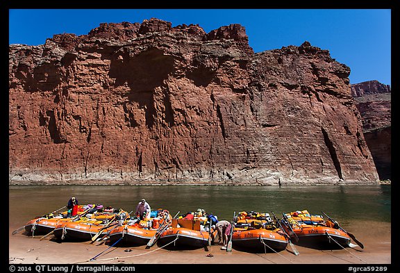 Rafts moored opposite redwall limestone cliff. Grand Canyon National Park, Arizona