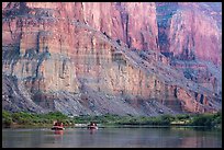 Rafts dwarfed by cliffs above the Colorado River. Grand Canyon National Park, Arizona