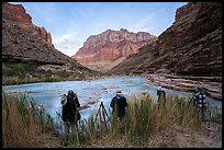 Photographers shooting from riverbank grasses at dawn, with the Little Colorado River in view. Grand Canyon National Park, Arizona ( color)