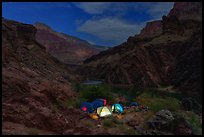 Night scene of illuminated tents at a remote campsite on the Colorado River. Grand Canyon National Park, Arizona ( color)