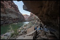 River rafters setting up camp beneath a rock overhang along the Colorado River. Grand Canyon National Park, Arizona ( color)