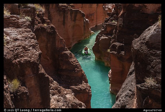 Rafter paddling through the turquoise waters of Havasu Creek. Grand Canyon National Park, Arizona (color)