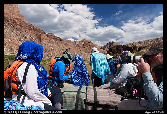 Rafters on a motorized raft wearing wet cloths for cooling down. Grand Canyon National Park, Arizona (color)