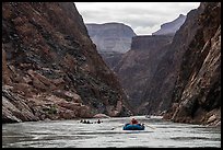 Oar-powered raft follows a flotilla through a dramatic canyon corridor in the Granite Gorge. Grand Canyon National Park, Arizona ( color)