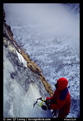 Topping out the stalactite of the Moulins Falls, La Grave. Alps, France