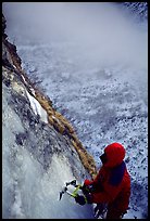 Topping out the stalactite of the Moulins Falls, La Grave. Alps, France