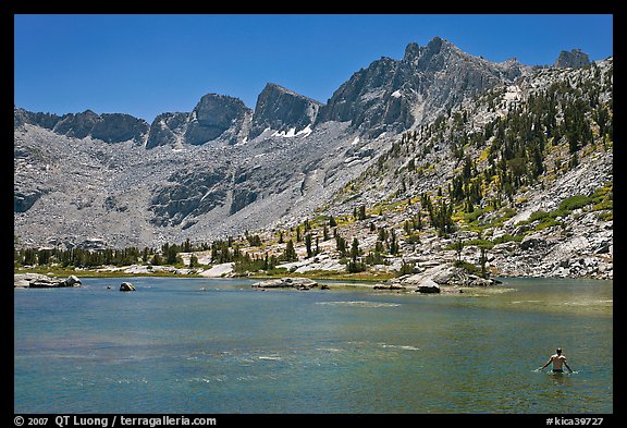 Man bathing in alpine lake, lower Dusy Basin. Kings Canyon National Park, California (color)