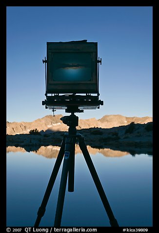 Large format camera with inverted image of mountain landscape on ground glass, Dusy Basin. Kings Canyon National Park, California