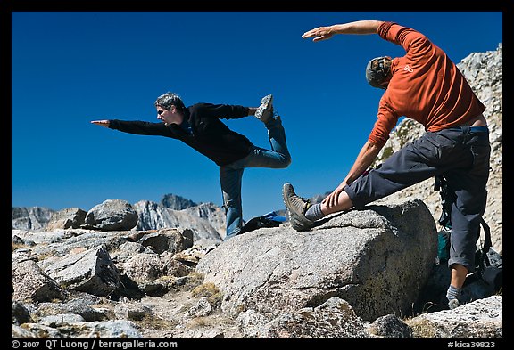Hikers doing stretching exercises, Bishop Pass. Kings Canyon National Park, California