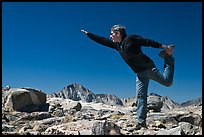 Hiker stretching, Bishop Pass. Kings Canyon National Park, California (color)