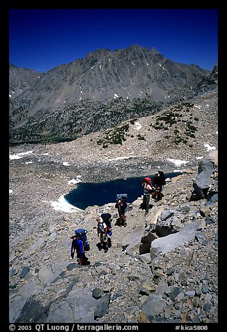 Backpackers near a tarn below Glen Pass, Kings Canyon National Park. California (color)