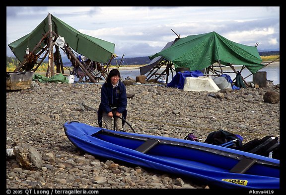 Inflating the canoe next to an Eskimo fish camp in Ambler. Kobuk Valley National Park, Alaska (color)