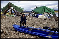 Inflating the canoe next to an Eskimo fish camp in Ambler. Kobuk Valley National Park, Alaska ( color)