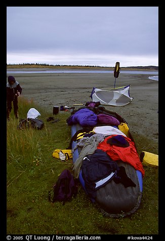 Gear laid out for drying on the bottom of the canoe on a small island of the Kobuk River. Kobuk Valley National Park, Alaska (color)