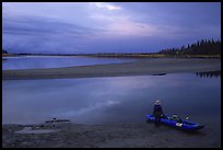 Standing next to the canoe on a sand bar, evening. Kobuk Valley National Park, Alaska ( color)
