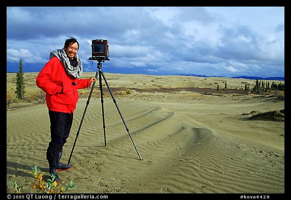 Large format photographer QT Luong with camera on Kobuk Dunes. Kobuk Valley National Park, Alaska (color)