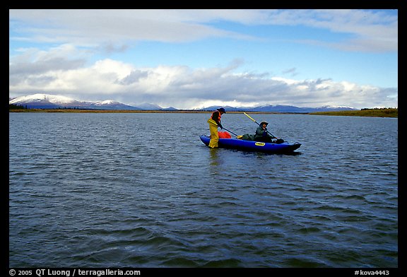 Canoeists on a wide and very shallow stretch of the Kobuk River. Kobuk Valley National Park, Alaska (color)