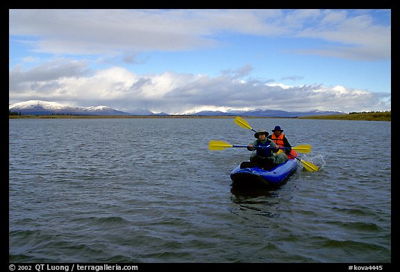 Canoeists Paddling on the wide Kobuk River. Kobuk Valley National Park, Alaska (color)