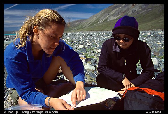 Women hikers consulting a map. Lake Clark National Park, Alaska