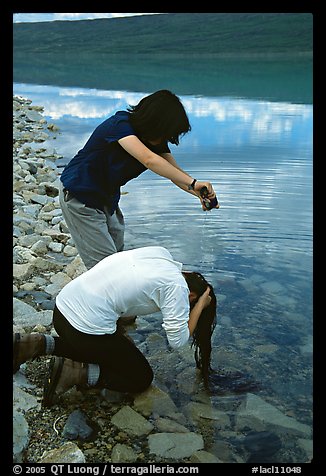 Backpackers cleaning up in Turquoise Lake. Lake Clark National Park, Alaska