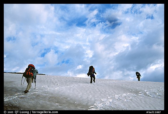 Backpackers crossing a neve. Lake Clark National Park, Alaska (color)
