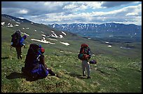 Backpackers take a pause when arriving on sight of Twin Lakes. Lake Clark National Park, Alaska ( color)