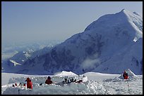 The low-profile tents have to be protected against the wind (which can reach 100mph). Climbers dig a hole and built thick snow-walls by sawing off large chunks of frozen snow. Denali, Alaska