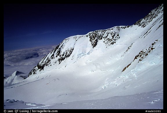 I leave by myself the camp for a summit attempt, taking a cut-off to the West Rib. The West Buttress route goes to the pass, through the steep wall, and is quite crowded. Denali, Alaska (color)