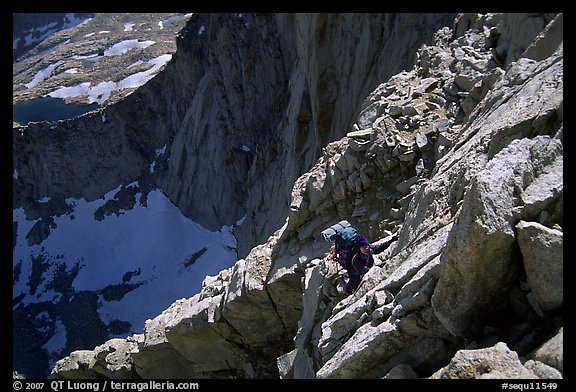 Mountaineer among broken rocks in the East face of Mt Whitney. Sequoia National Park, California